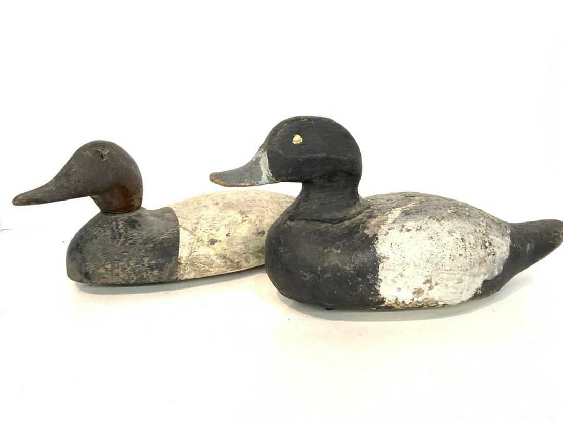 Two Canvasback Duck Decoys: Two (2) Canvasback duck decoys. Hand carved. .One with glass eyes, second has eyes missing. Heads slightly loose. Please see photograph preview or call. 1st half 20th century.Dimensions: 7 1/2" X 13" 