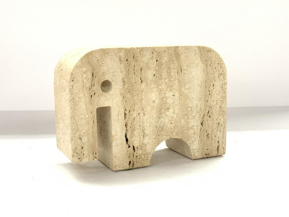 Travertine Elephant Statue: Travertine elephant statue. Dimensions: 4 1/2"h X 6 1/2" X 2 1/4"