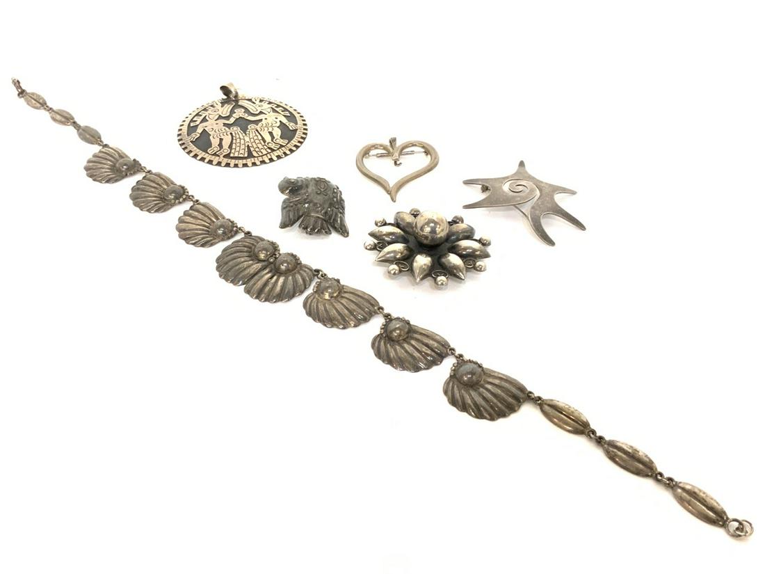 Mexican & Indian Sterling Silver Jewelry Group: Compiled Mexican and Indian assorted sterling jewelry necklace and pins as seen in photograph preview. Mexico "Mate" pin is missing closure. Provenance: Curated collection over 70+ years of purchasing