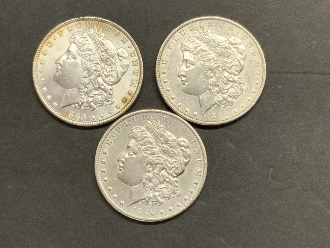 Three (3) 1886 U.S. Morgan Silver Dollars (1 of 3)