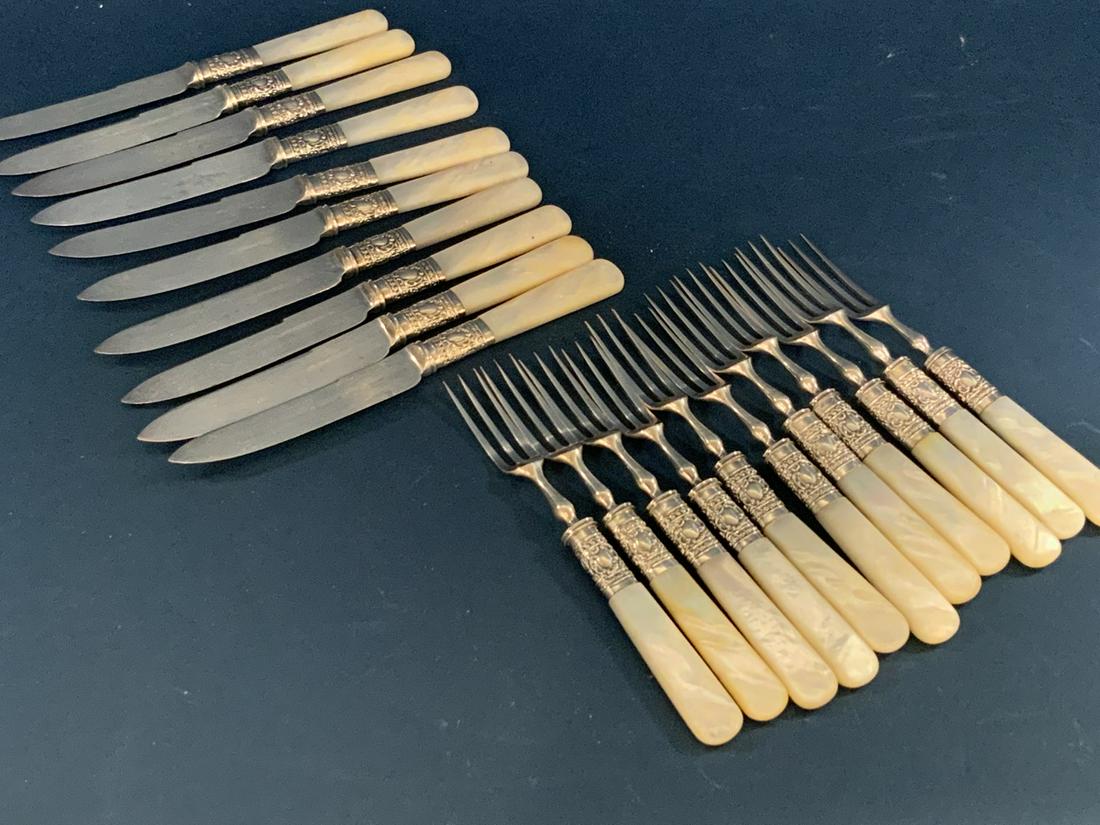 Mother Of Pearl Cocktail Forks And Knives Set: Silver plated mother of pearl handled pickle forks and knives set. Twenty (20) pieces. Dimensions: 5 1/2" length