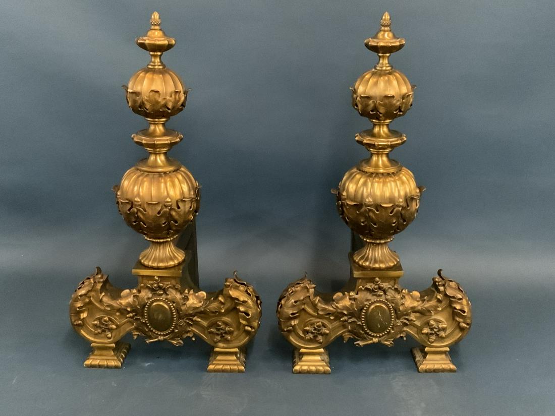 Highly Ornate Monumental Size Bronze Andirions: Monumental castle size Acorn finial bronze andirons. Very highly ornate design with acorn finial top and clusters of acorns and leaves at base. Correctly replaced back leg bars. Dimensions: 35 1/2"h X