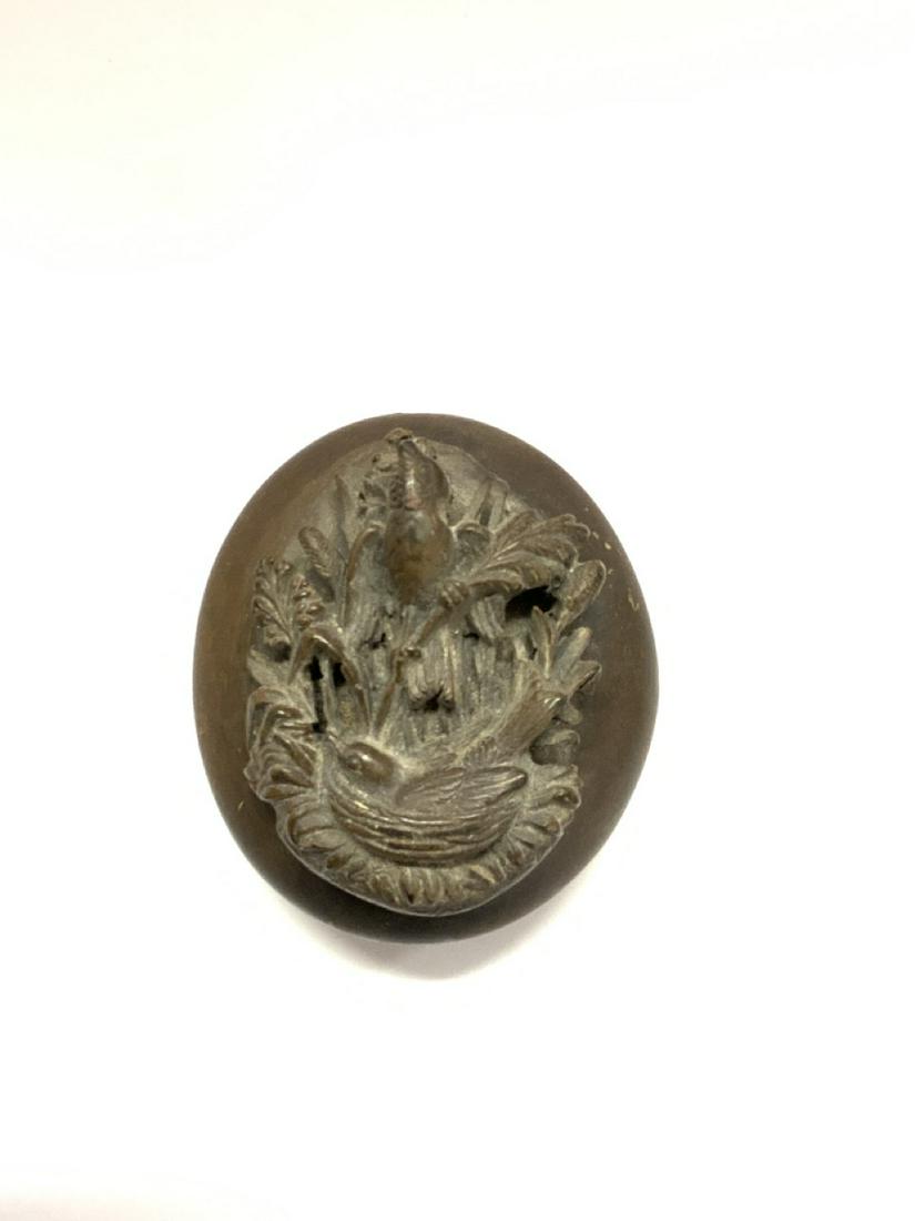 19th c. Nesting Birds Guttapercha Jewelry Locket: 19th century Guttapercha locket with birds in nest. Crack near hinge. Please see photograph preview. Dimensions: 1 3/4" X 1 1/2"