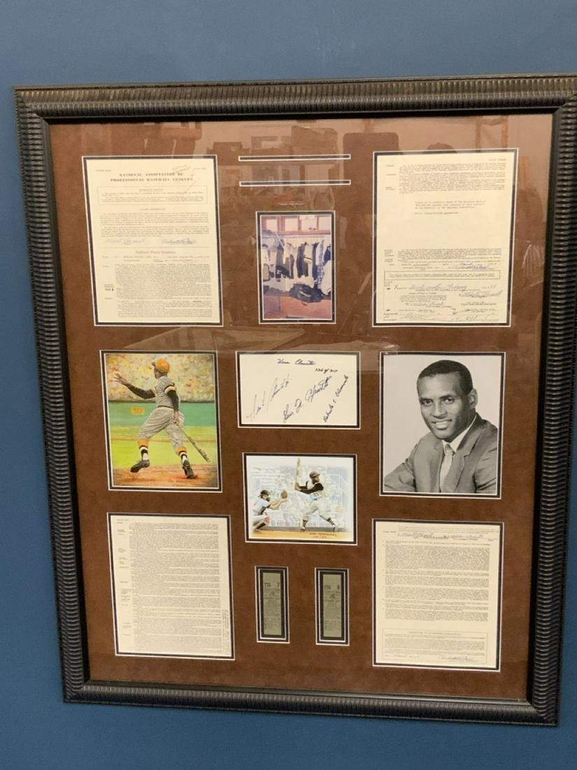 Roberto Clemente Huge Wall Art 43 1/2" X 36 1/2": Roberto Clemente decorative wall collage. YMC sports guarantee. Facsimile contracts, signatures, photograph and art.Dimensions: 43 1/2" X 36 1/2" framed