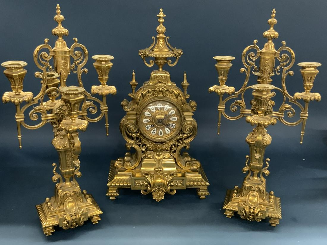 Japy Freres French Bronze Clock Set: Japy Freres Bronze Clock Set with Candelabra. 19th century. Dimensions: 18 3/4"h X 10" X 7" and 18 3/4" X 5" X 4 1/2"