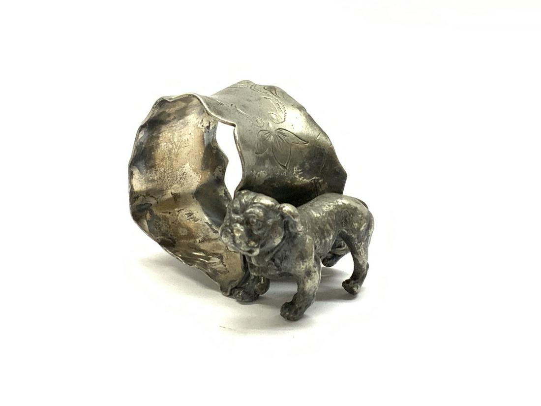 Victorian Bull Dog Napkin Ring: An antique silver plated bulldog napking ring. Dimensions: 1 1/2" X 2 1/4"