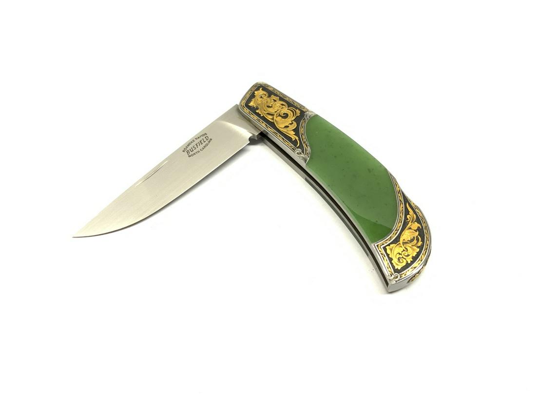 Jack Busfield Apple Jade Knife Engraved By Sam Alfano: Jack Busfield folding knife.Apple green jade with 24kt gold engraving by Sam Alfano. C. 5/92 2 1/4” blade and 5 1/4” overall. Provenance: Single owner estate collection. Family wishes to s