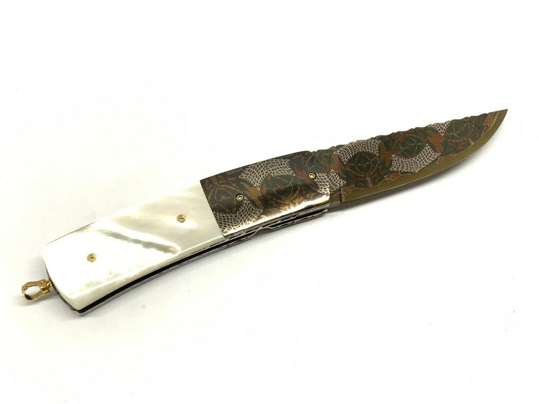 Johan Gustafsson (Swedish) Custom Damascus Blade Knife: Johan Gustafsson (Swedish) Folding custom knife with damascus blade and 18k gold. Dimensions: 2 3/4" blade and 7" overall. Provenance: Single owner estate collection. Family wishes to see this collect
