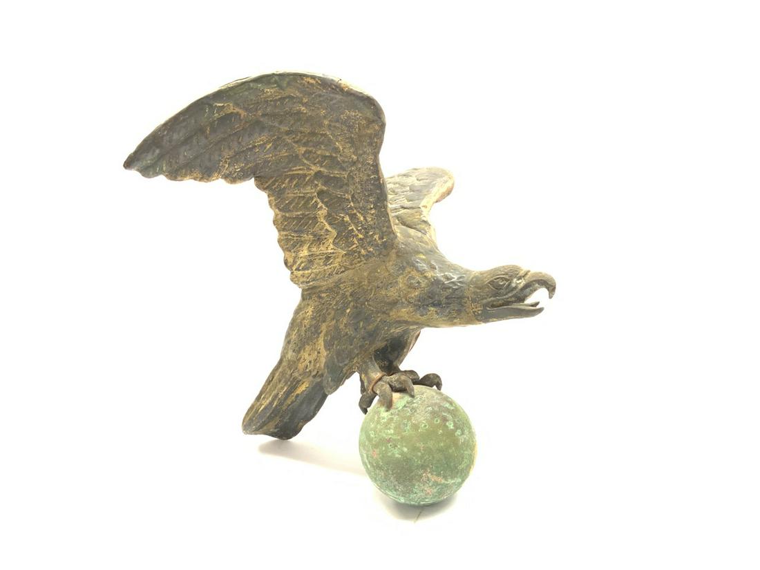 19th c. Full Bodied Eagle Weathervane Topper: 19th c. Full bodied eagle perched on ball weathervane topper. Very good gold gilt paint still present. Dimensions: 12” x 12” x 15”