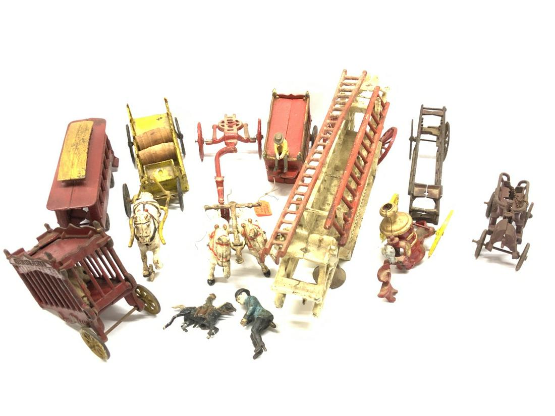 Cast Iron Toy Lot: Assorted cast iron toy lot. Circus cars, horse drawn fire etc.
