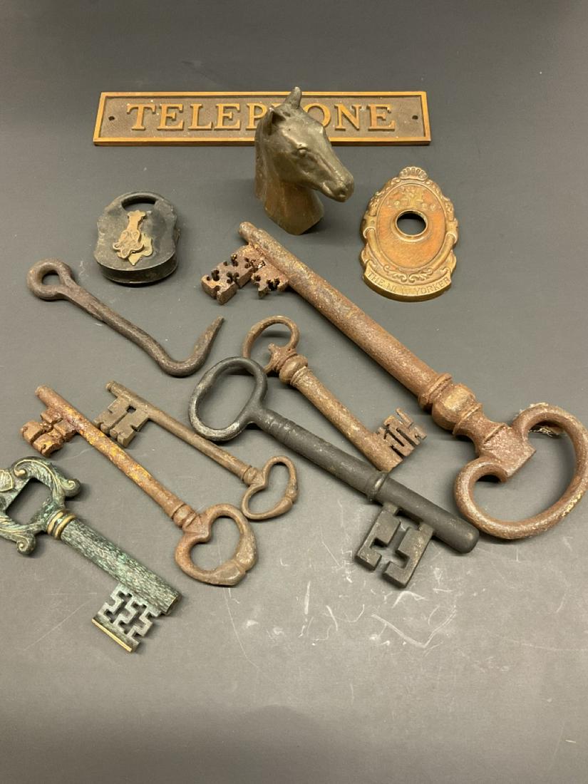 Estate Curious Lot, Metalware..: Assorted metal grouping. Vintage and antique keys, telephone booth sign, New Yorker hotel architectural door knob frame 1929, old lock etc.