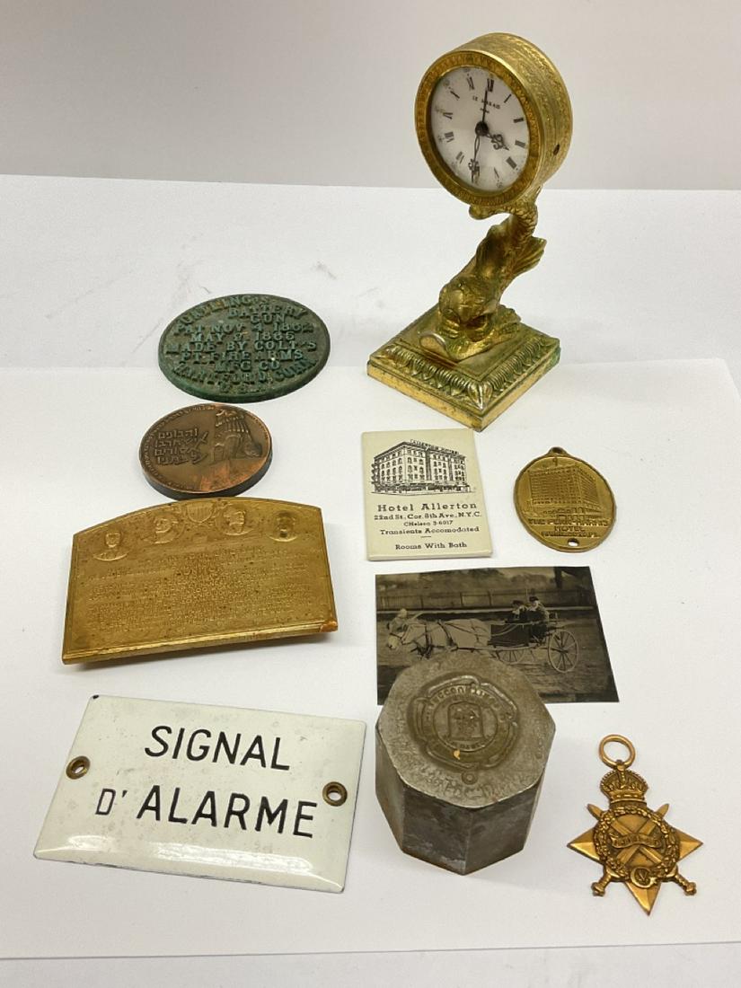Estate Curious Lot, Antiques, Metalware, Historical..: Assorted estate metal ware objects. Hotel Allerton advertising mirror, Captain John Ericsson bronze medallion/monitor, Le Marais Paris clock (As is), Colt's Gatlings Battery Gun cap etc. Please see ph