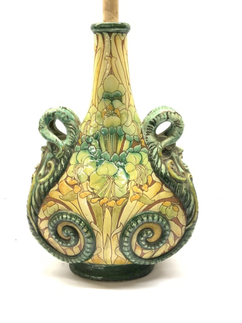 Cassandra Annie Walker Arts & Crafts Pilgrim Vase c.1900 For Della Robbia: Cassandra Annie Walker For Della Robbia, Large Earthenware "Pilgrim" vase converted to a table lamp. Drilled hole on back side and at base. Even crazing and some paint chips seen. Estate find. circa 1