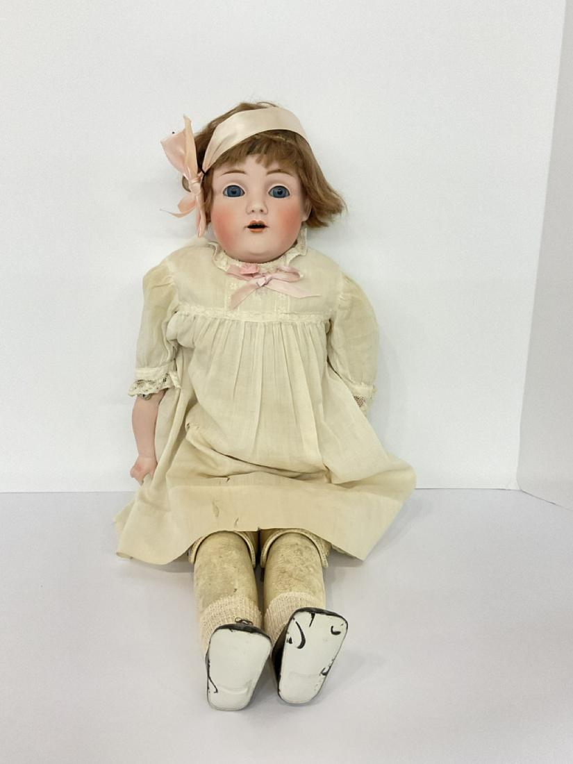 Kestner, German Bisque Doll: A German bisque doll with kid leather body. Overall appearing all original. Marked DEP 154 at neck. Dimensions: 23” x 8”