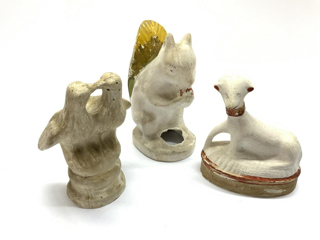 Early Chalkware Grouping: Three early chalkware figures. Sheep, Love birds and squirrel. All tagged CYR Auction Company Jean Curtin collection. Love bird: Dimensions: 7 1/2” x 4” x 3 1/2” Sheep: Dimensions: 5