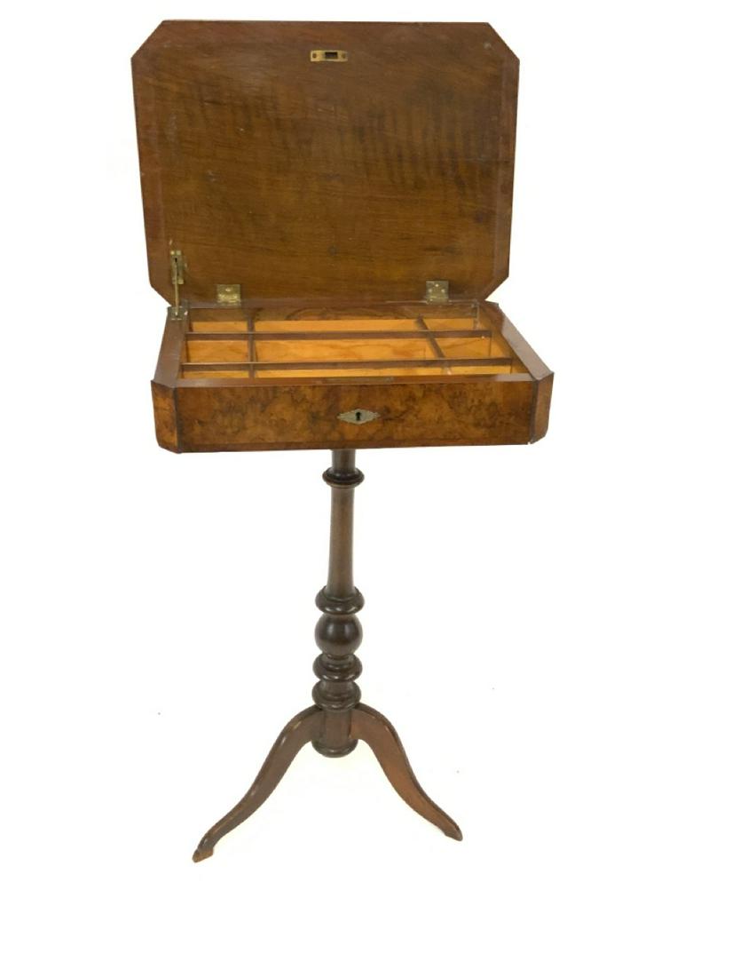 Burlwood Veneered Sewing Table: Burlwood veneered sewing table on tripod base. Dimensions: 30 3/4" X 20" X 15"