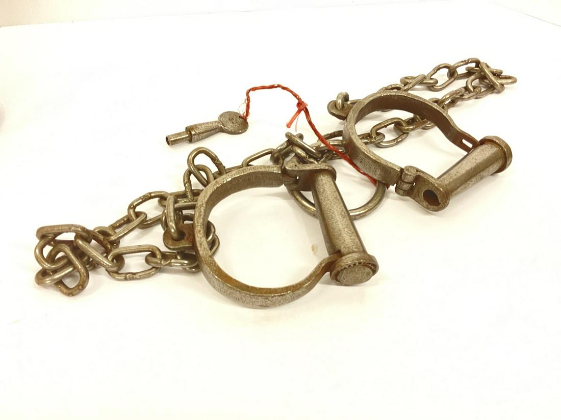 Miltiary Darby "D" Prison Shackles: Military Darby D style wrist or ankle shackles with keys. Dimensions: 3 3/4" X 4"