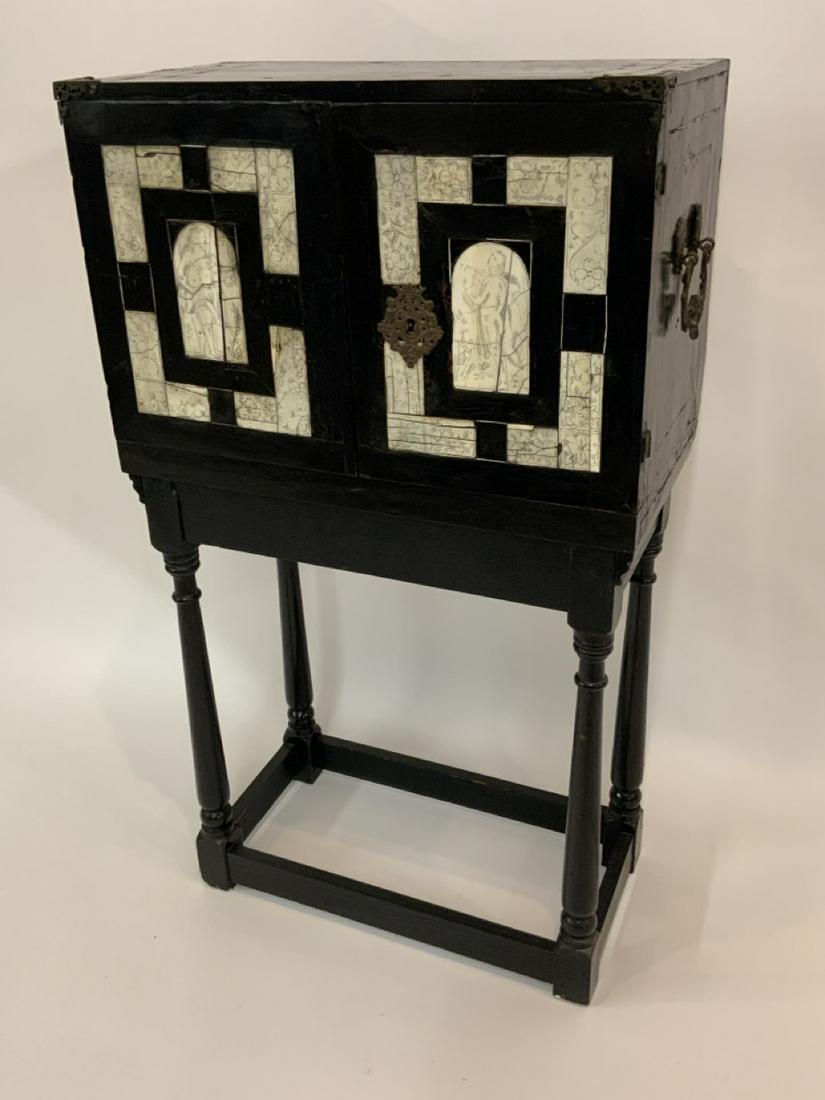 Antique Ebonised Wood And Bone Cabinet On Stand: An antique ebonized wood and bone inlayed cabinet on stand. Dimensions: 39” x 22” x 12”