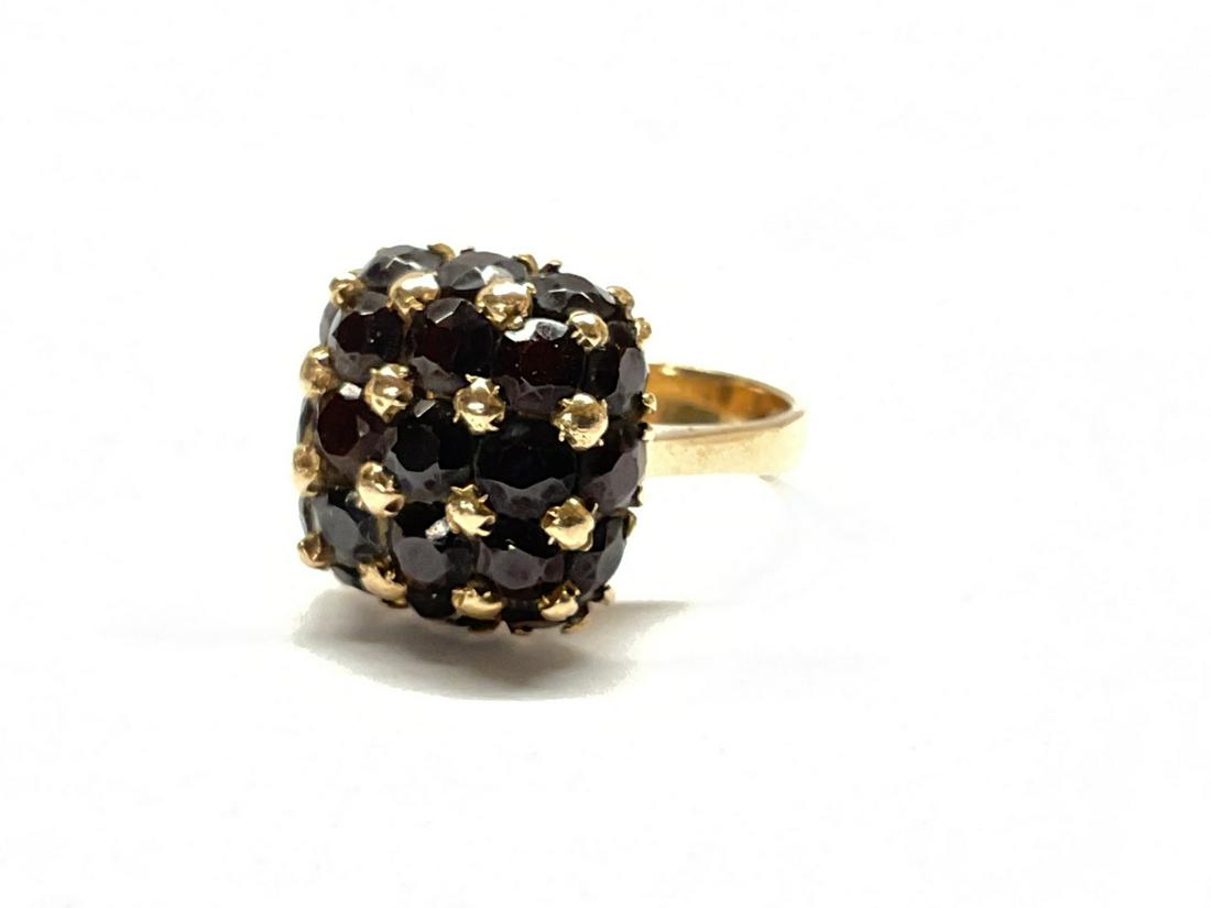 18K Yellow Gold Garnet Cluster Ring: An 18k yellow gold square form ring with garnets. Size 8.5 Total weight: 8.82 grams