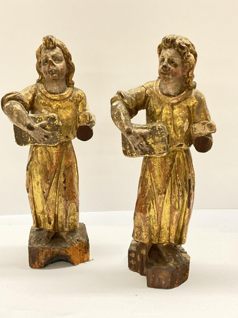 Two (2) 19th c. Santos Figures: Two (2) 19th century polychrome and gold gilt paint decorated Santos figures holding tablets or books. Some apparent damage noted consistent with age. Please see photograph preview or call. Dimensions