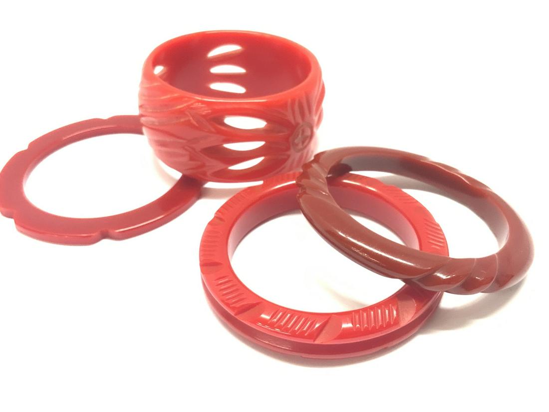 Four (4) Carved Red Bakelite Bangle Bracelets: Four (4) Carved Red Bakelite Bangle Bracelets