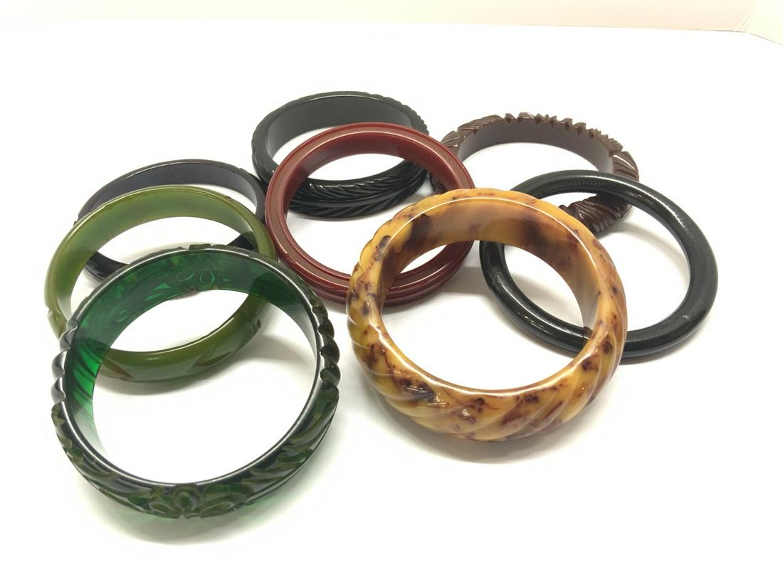 Eight (8) Carved Bakelite Bangle Bracelets: Eight (8) Carved Bakelite Bangle Bracelets including green, marblelized caramel, brown, brick red etc.