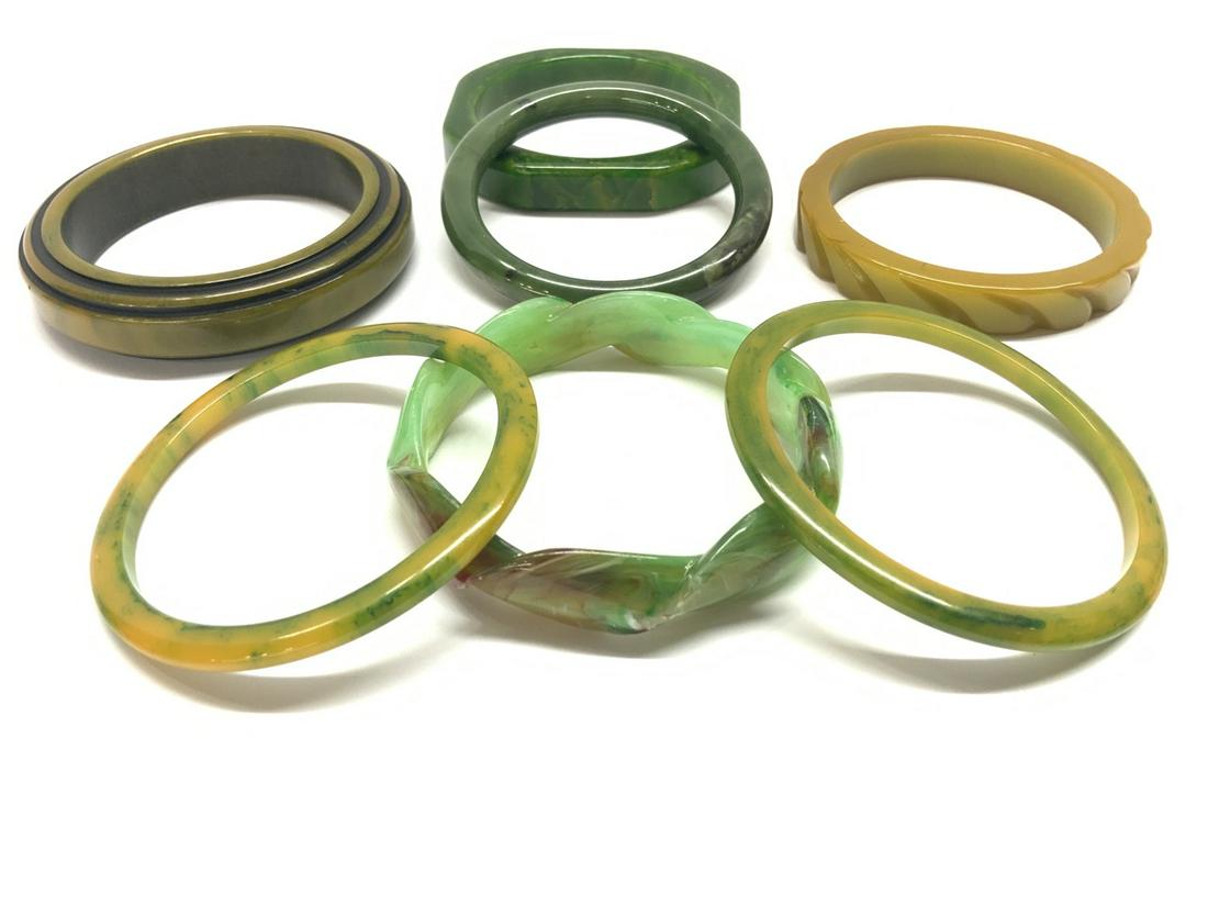 Seven (7) Bakelite Bangle Bracelets: Eight (8) Bakelite Bangle Bracelets. Seven pieces total inlcuding olive green, spinach, creamed spinach etc.