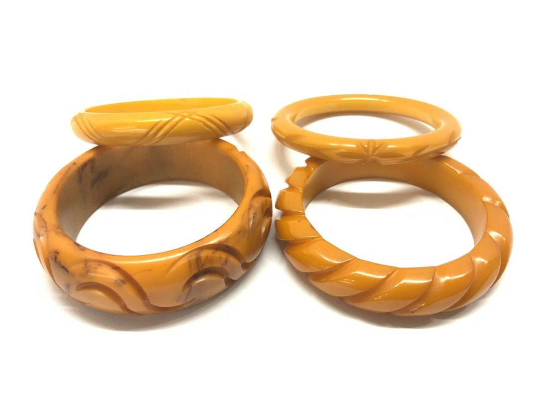 Four (4) Bakelite Bangle Bracelets: Four (4) Bakelite Bangle Bracelets Carved caramel.