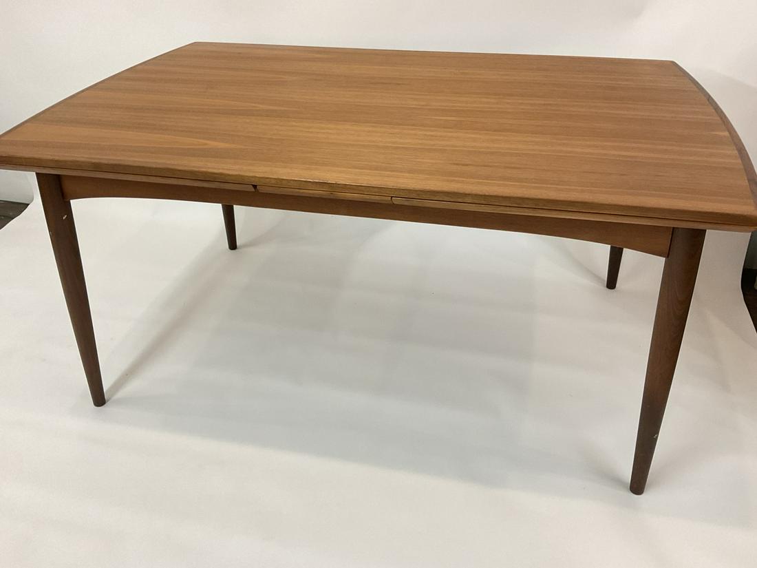 Danish Modern Teakwood Dining Room Table: Danish Modern Teakwood Dining Room Table With Refracting Leaves. Very fine condition. Minimal wear. Dimensions: 28"h X 60 1/2" X 40" and 24" leaves at each side.