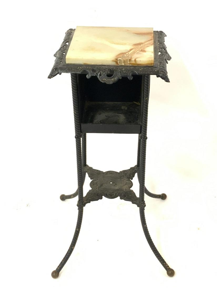 Antique Iron And Marble Top Table: Antique iron and marble top pedestal table. Dimensions: 29 1/2" h X 13" X 13"