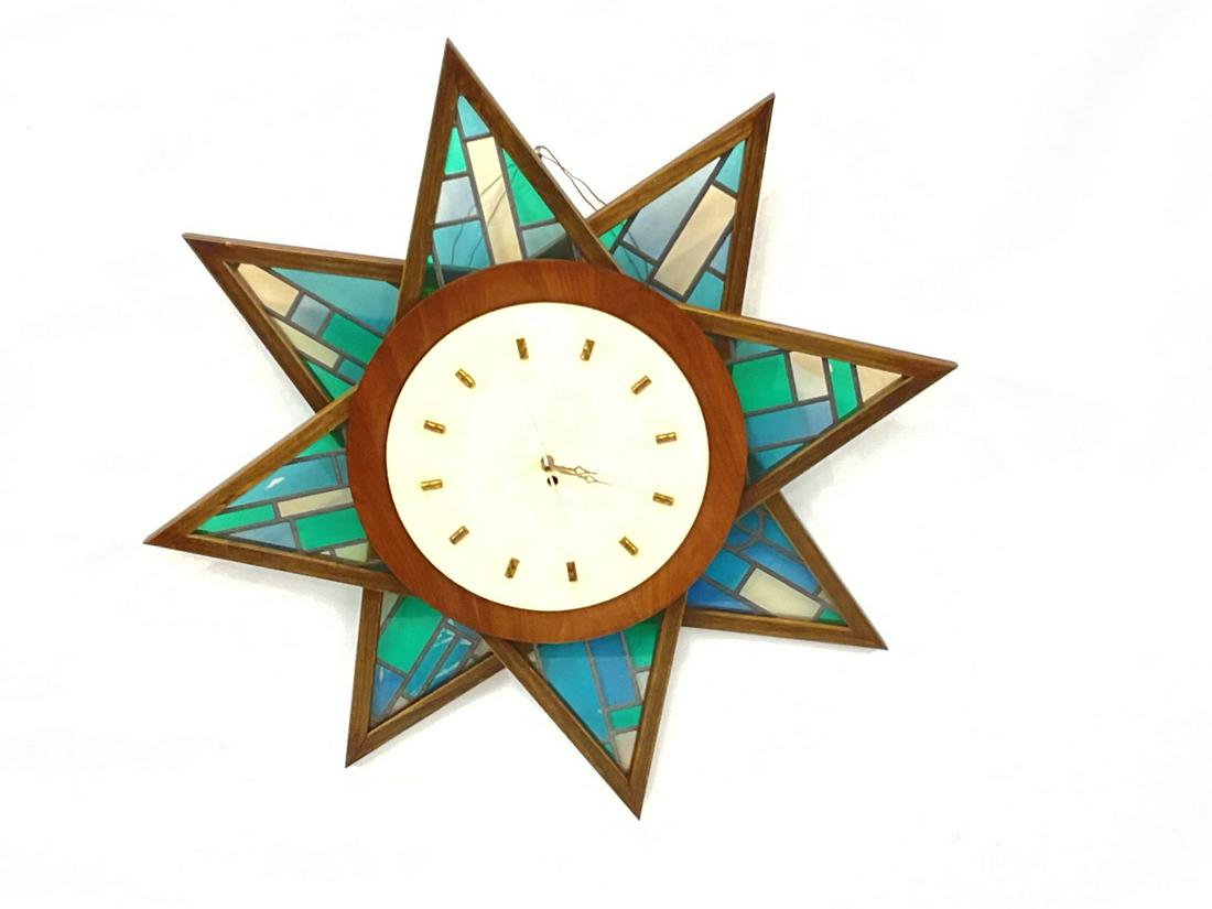 Vintage Starburst Stain Glass Wall Clock: Penhouse Art Creations Stain Glass Starburst Wall Clock. Dimensions: 34 1/2" Diameter. Clock is battery operated.