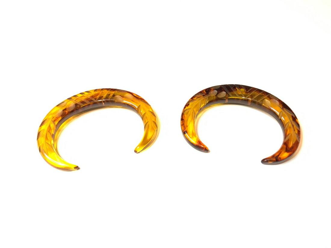 Matching Pair Of Apple Juice Lucite Pins: A matching pair of carved apple juice lucite pins. Dimensions: 3" X 2"