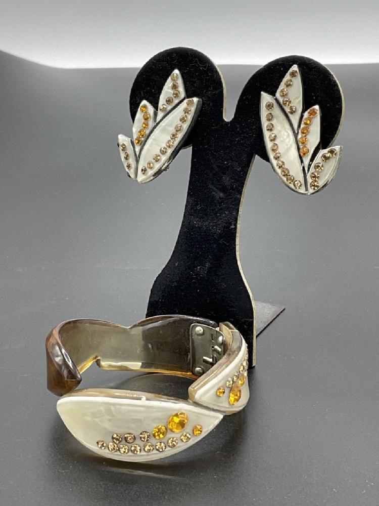 Vintage Elegant Laminated Jeweled Bakelite Jewelry: Laminated Bakelite with jeweled rhinestone clamper bracelet and matching earrings.