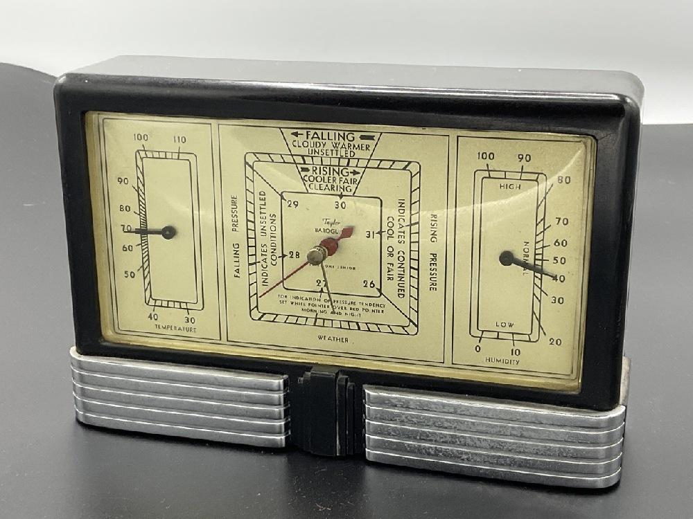 Taylor Fairmount Junior Bakelite Weather Center: Fairmount Junior Taylor Baroguide. Black Bakelite and chrome weather center. Dimensions: 5 1/4" X 8" X 2"