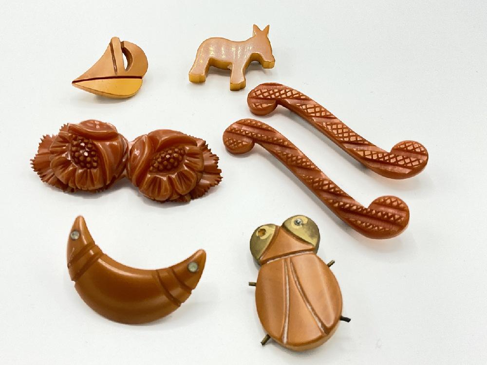 Seven (7) Butterscotch Bakelite Figural Pins (1 of 7)