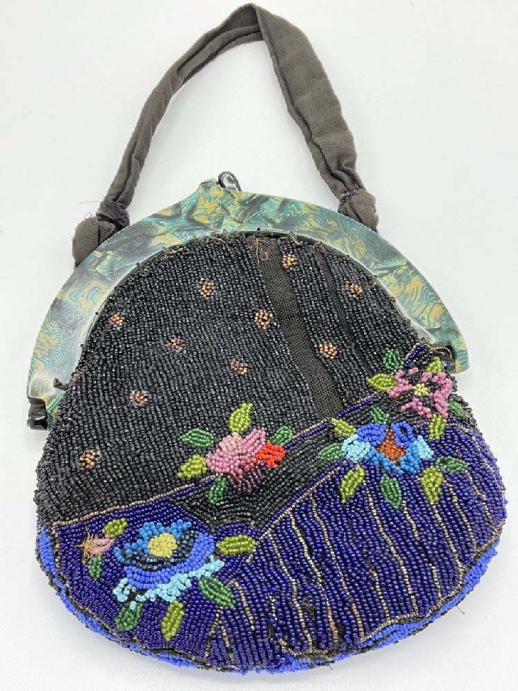 Bakelite Beaded Purse: Beaded bag with Bakelite frame. A highly decorative turquoise/blues/black design. Dimensions: 8 1/2" X 7" and 13" drop with strap.