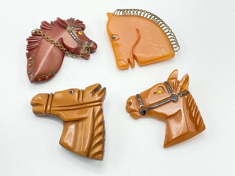 Four (4) Carved Bakelite Horse Pins (1 of 4)