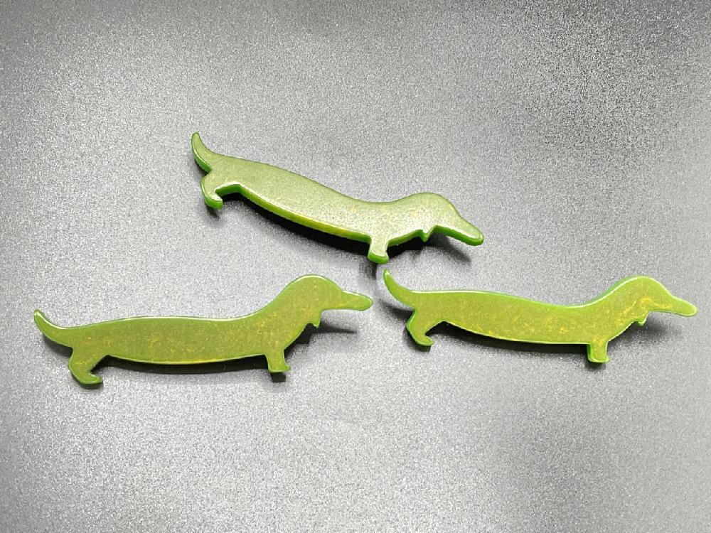 Three (3) Marbled Green Bakelite Dachshund Dog Pins: Three (3) Green marbled swirl Bakelite Dachshund dog pins. Dimensions: 1” x 3 1/4”