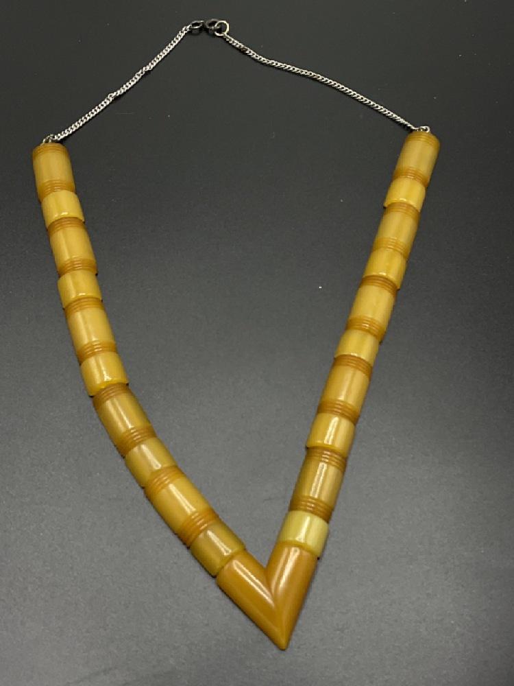 Art Deco "V' Geometric Bakelite Barrel Necklace: Art Deco "V" Geometric yellow Bakelite barrel Necklace. Dimensions: 22" length and 12" drop.