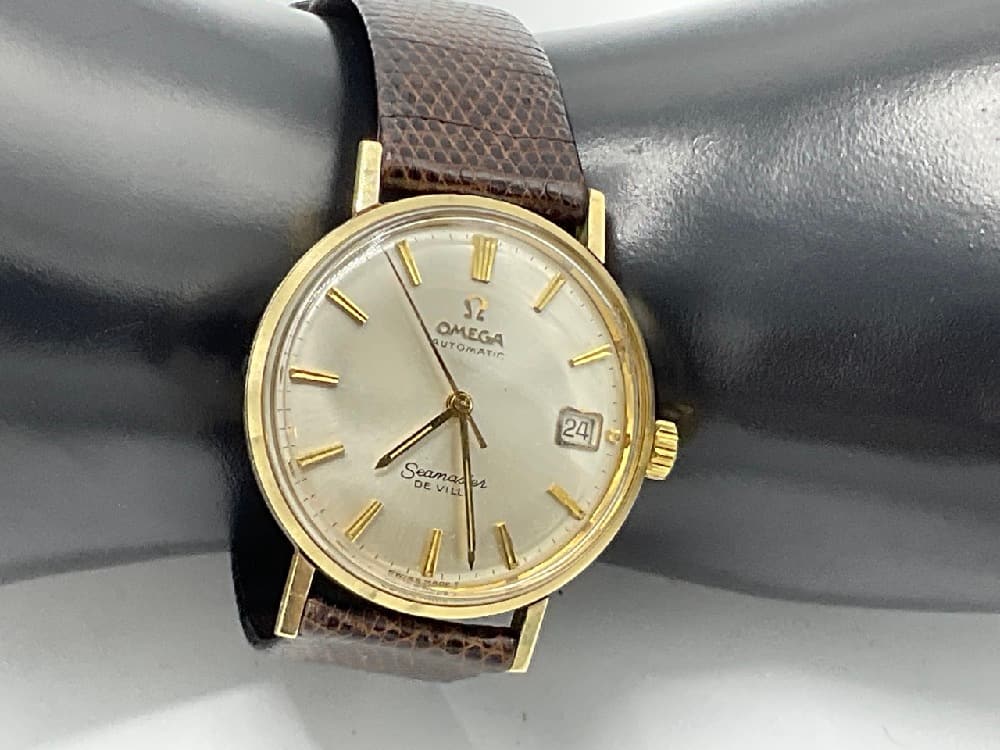 Vintage Omega Seamaster Deville Men's Wristwatch: Vintage Omega Seamaster Deville automatic day with lizard skin band. Working condition.