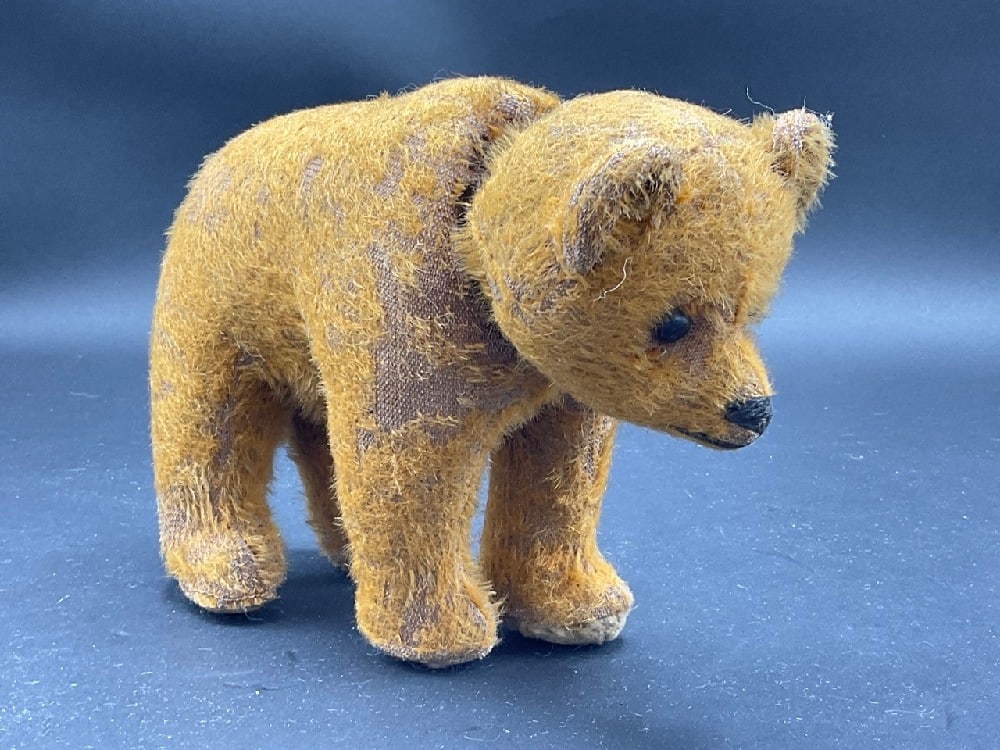 Antique Mohair Wagging Tail and Moving Head Teddy Bear: Early mohair bear standing on all four legs. When head moves tail wags and vice versa. Unsigned. Dimensions: 6” x 8” x 3 1/2’