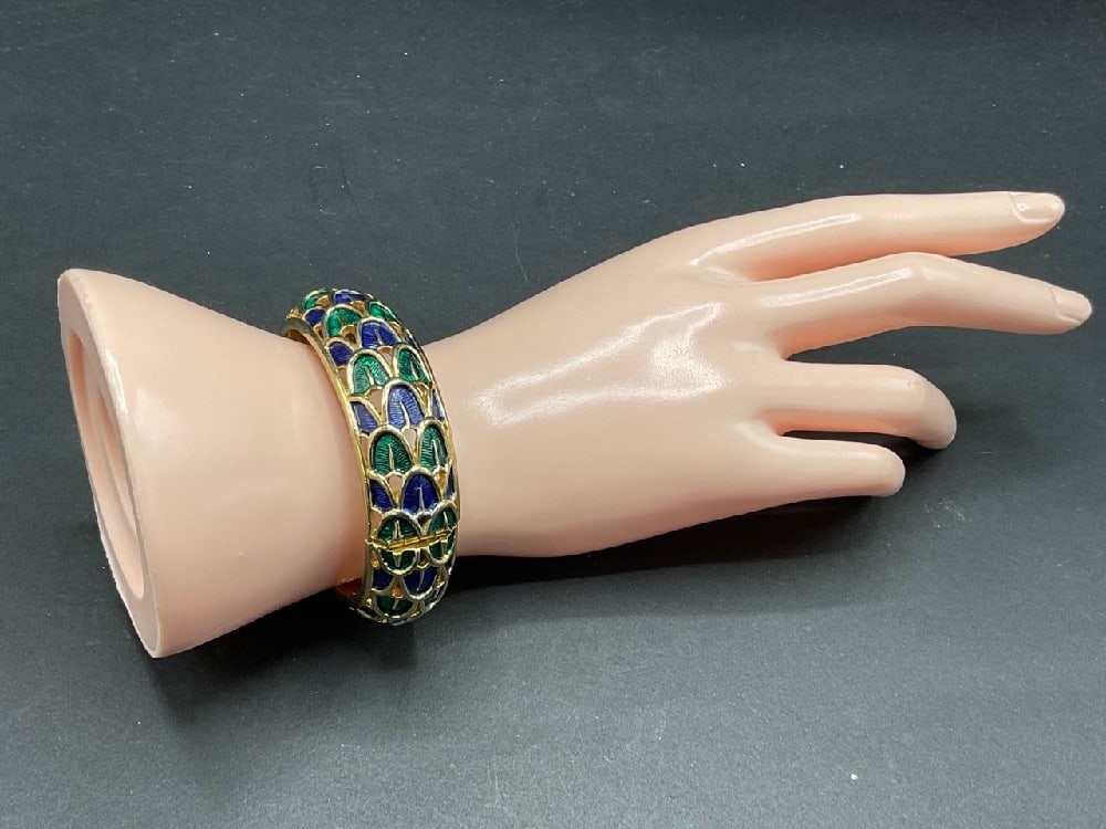 Marcel Boucher Enameled Hinged Bangle: Marcel Boucher enameled hinged bangle bracelet. Dimensions: 2 3/4” d and 3/4” width