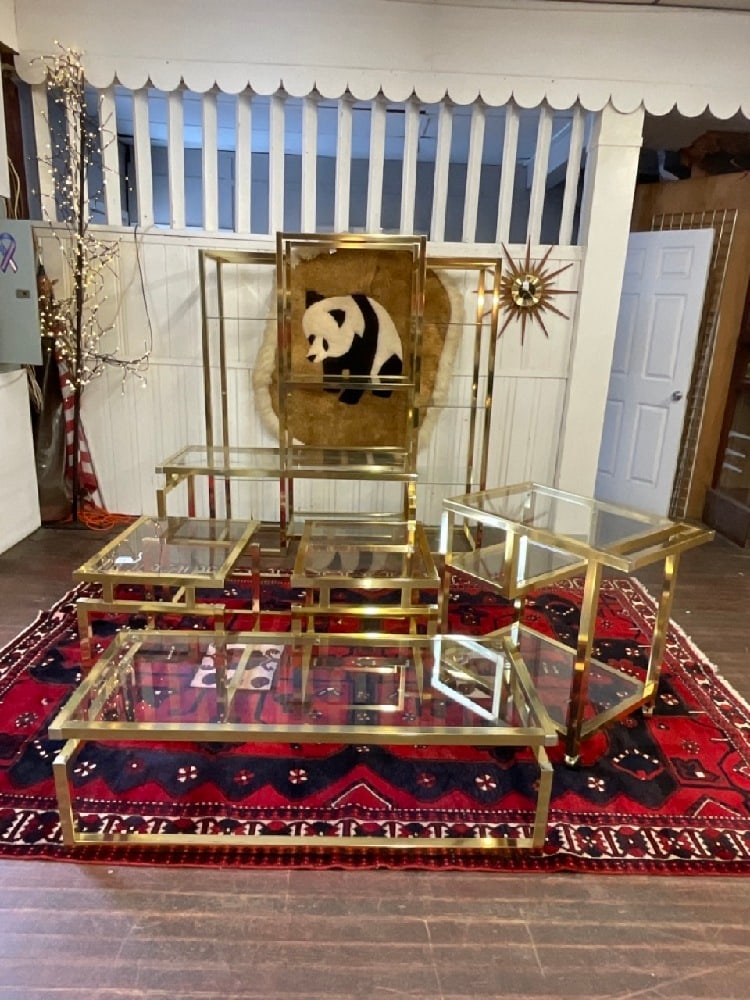 Eight (8) Piece Metal and Class Shelving, Displays, Tables, Teacart: Eight (8) Piece, very light weight metal with brass color and chrome finish. Clean set including wall unit, tea cart, hallway table and mirror, two console tables and two end tables. Dimensions: 72