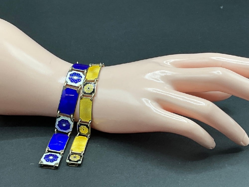 Two (2) David Andersen Sterling Silver 7” Bracelets: Two (2) David Andersen sterling silver 7" bracelets. Made in Norway. Blue enamel with white flowers and yellow with white flowers. No enamel loss, near mint. Total weight: 34.50 grams