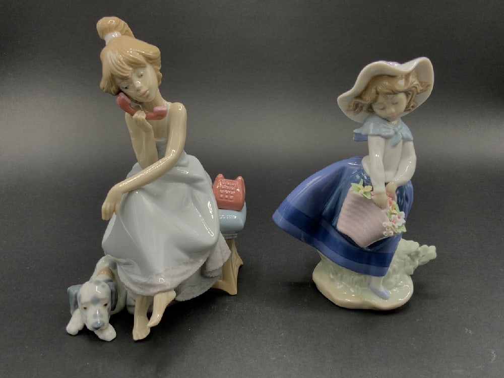 Two (2) Lladro Porcelain Figurines: Lladro Chit Chat Girl #5466 Lladro Daisa1983 StatuesDimensions: 8” H x 6” W, 7” H x 4”WGood Condition, Please See Preview Photographs