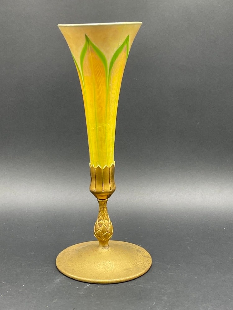 Tiffany Studios Favrile Glass Lamp with bronze base (DAMAGED): Tiffany Studios New York Favrile glass vase mounted in a bronze base. Signed. Glass is badly damaged and cracked. Please see photograph preview. Dimensions: 12” x 5”
