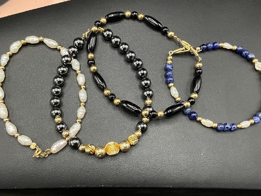Four (4) 14K Gemstone Bracelets: Four (4) 14K Gemstone Bracelets.Lapis onyx, hematite and freshwater pearls with 14 karat gold,6" length.