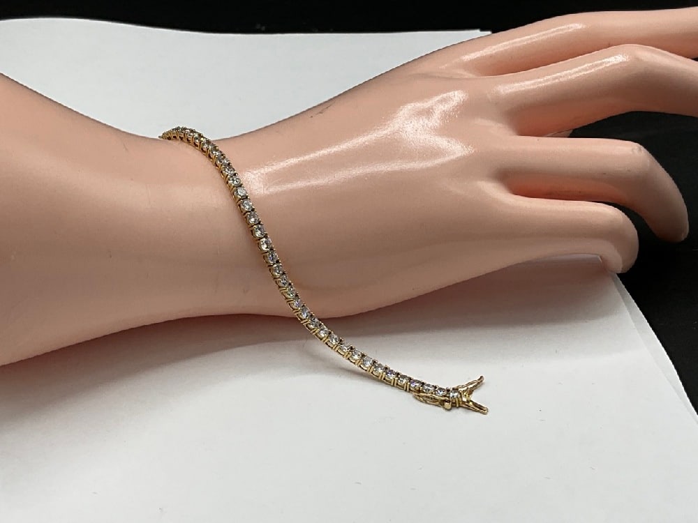 14K Diamond CZ Bracelet: 14K Diamond CZ Bracelet.7” length Tw: 7.87 grams