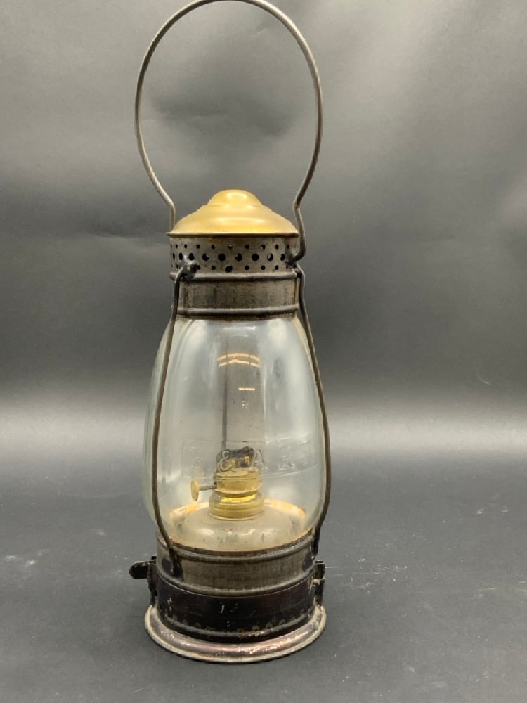 Boston & Albany Railroad Lantern B&A RR , Brass Top: Boston & Albany Railroad Lantern B&A RR , Brass Top and embossed globe. Dimensions: 14 1/2” x 4 1/2” Provenance: Collection from The Estate of Glen Morris.