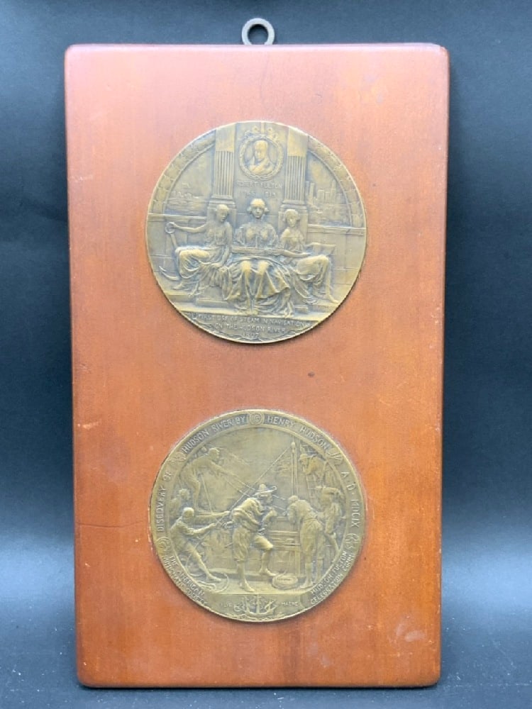 Bronze Medallion Plaque Hudson Fulton Celebration: Two bronze plaques mounted in wood frame. "Official Medal of the Hudson-Fulton Celebration Committee." Designed by Emil Fuchs.Issued bt NYS Education Dept.